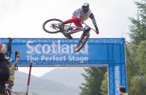 A mountain bike jumping, at the Fort William World Mountain Bike Championships