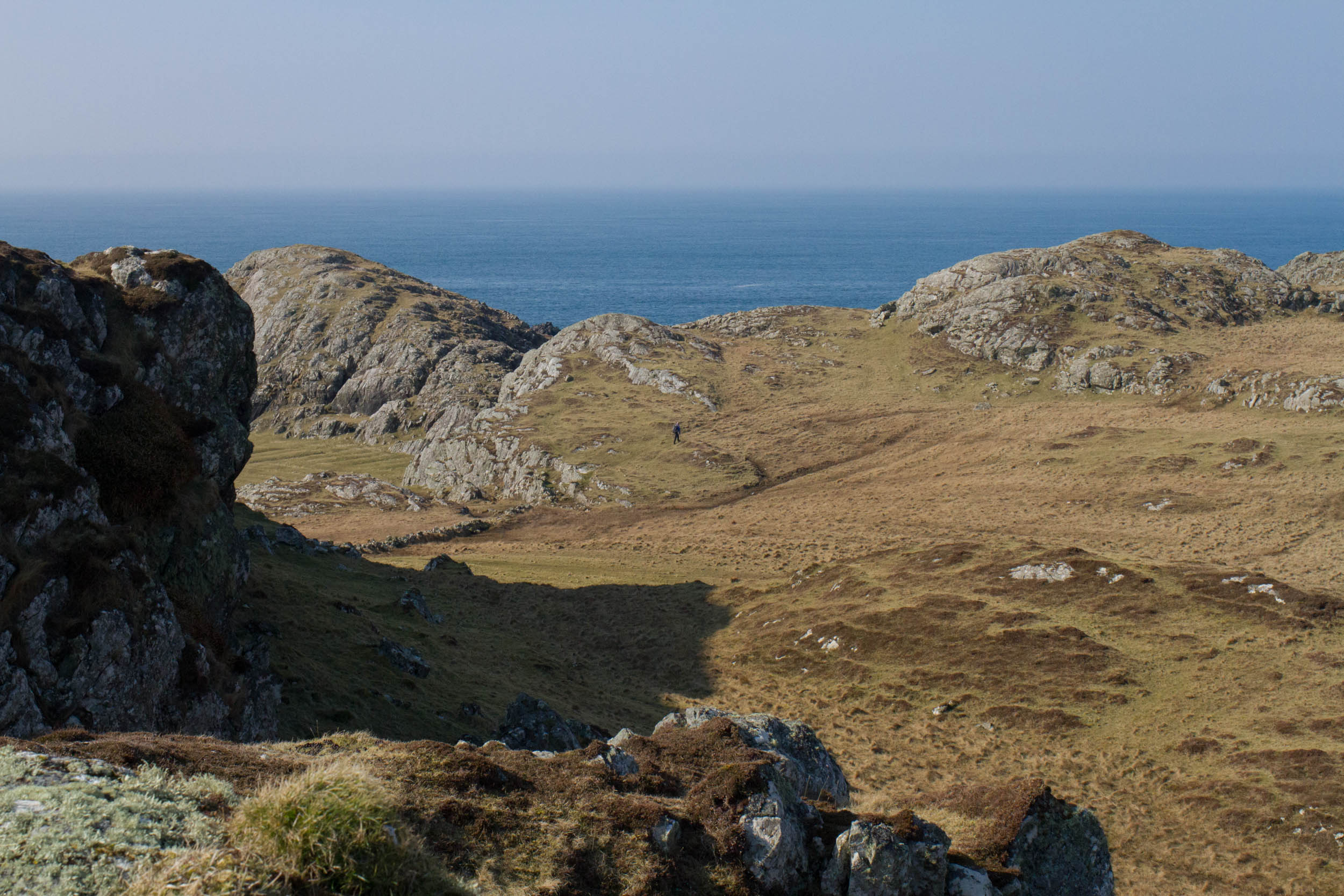 Isle of Mull, Rocky coastline and calm sea in the background